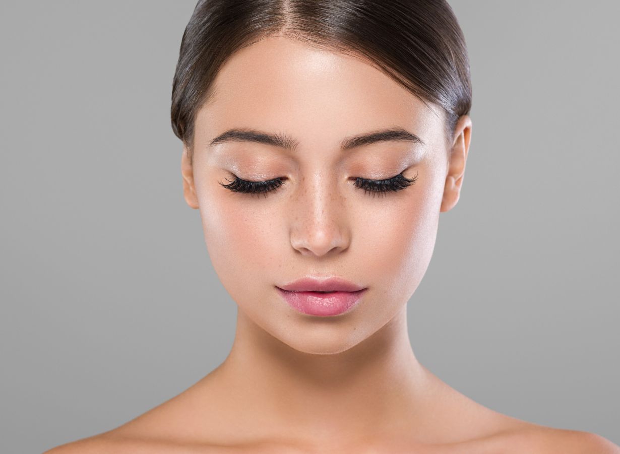 model with her eyes closed looking downward