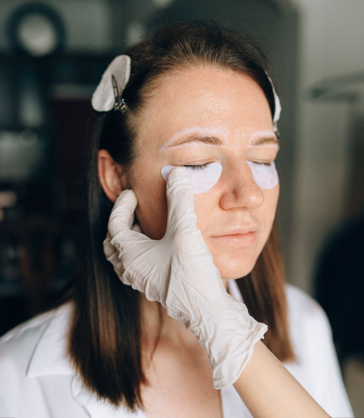 clinician applying a eye patch for a Lash Extension